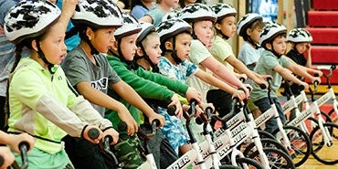 Kindergartners learn to ride bikes