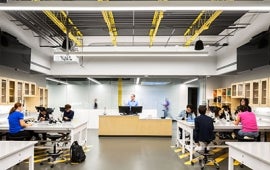 Bellevue University lab with instructor and students sitting at lab tables