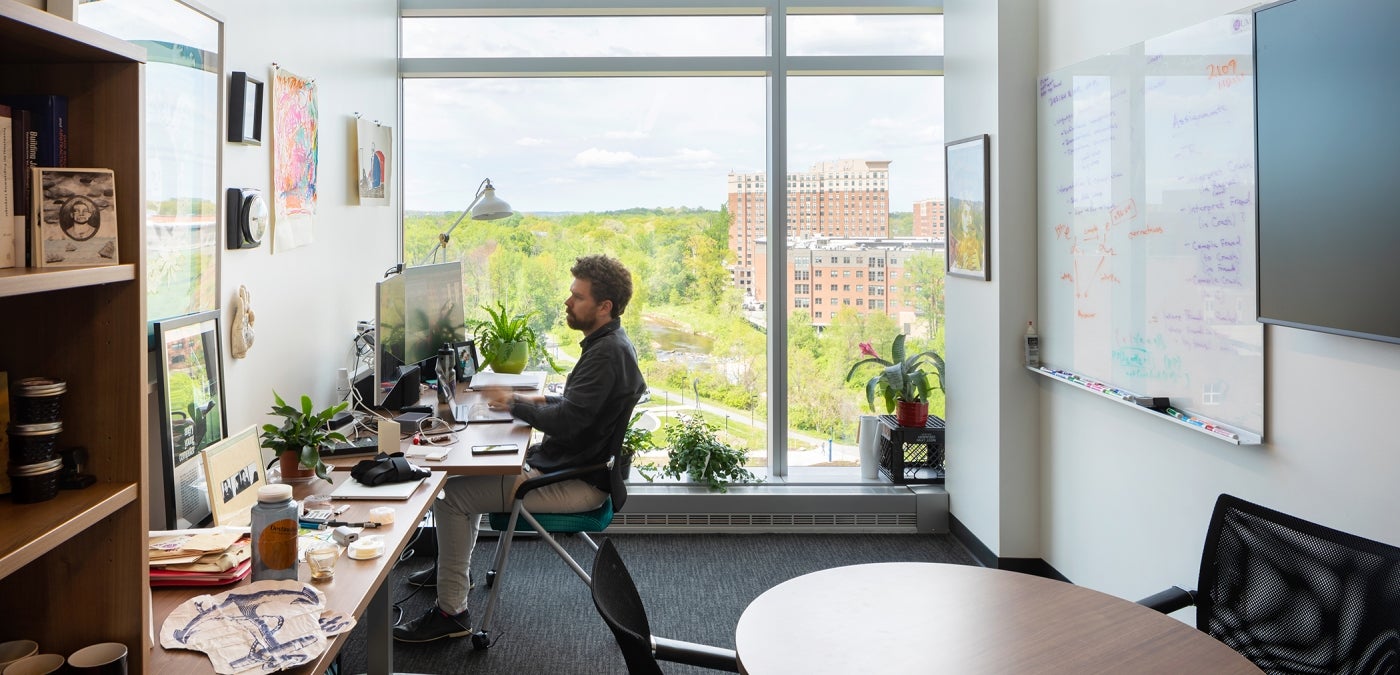 professor working in office at Brendan Iribe Center for Computer Science and Engineering