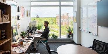 professor working in office at Brendan Iribe Center for Computer Science and Engineering