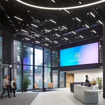 Reception area at Assembly Bristol, UK. A large screen with BT is fixed to the wall.