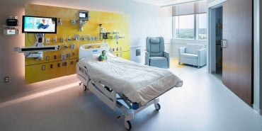 Interior of hospital room with hospital bed.