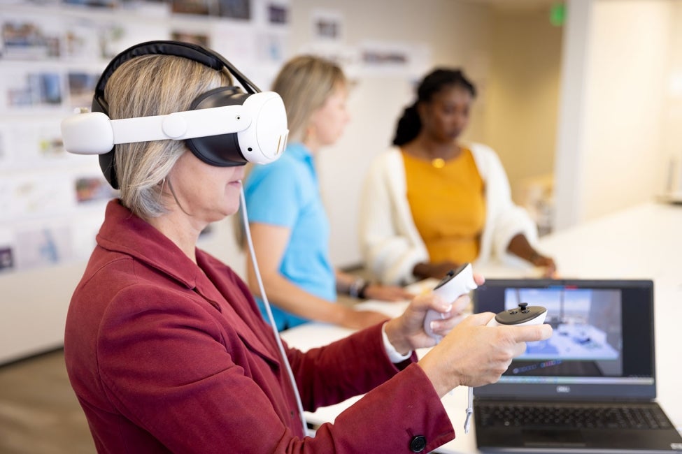 Denver employees use VR glasses