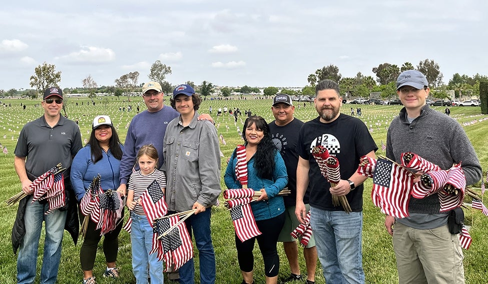 California HDR employees bring flags for veterans' graves on Memorial Day