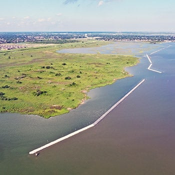 Aerial view of marsh complex and breakwater at Dollar Bay Marsh in Galveston, Texas.