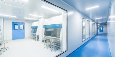 a hallways with a window into a cleanroom