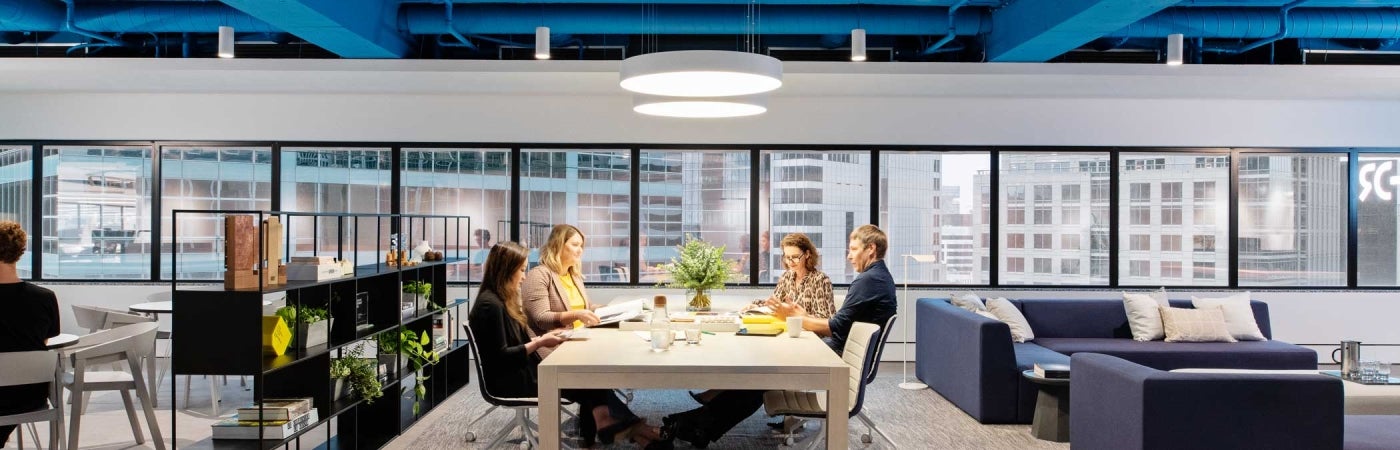 HDR office in Sydney Australia. Employees at table meeting.