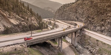 curving road going through mountain valley