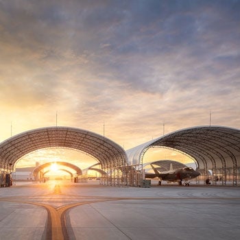 aircraft shelter at sunset