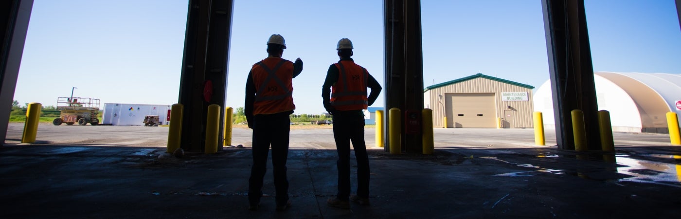 Silhouette of staff looking out facility