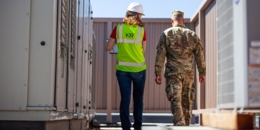 military installation, two people walking