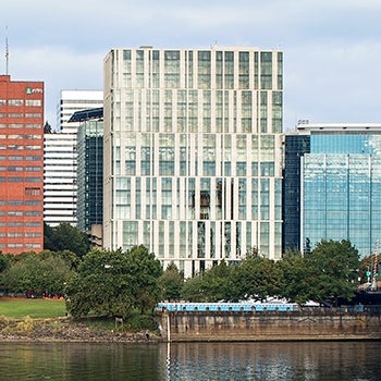 exterior view of Multnomah County Courthouse on the river bank