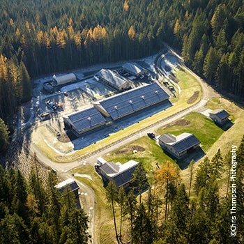 Aerial view of Native Salmonid Conservation Facility and surrounding property and woods.