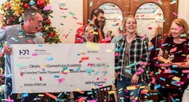 Teachers from Oklahoma Connections Academy receive a check