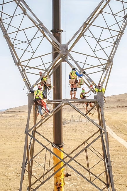 Workers on transmission line