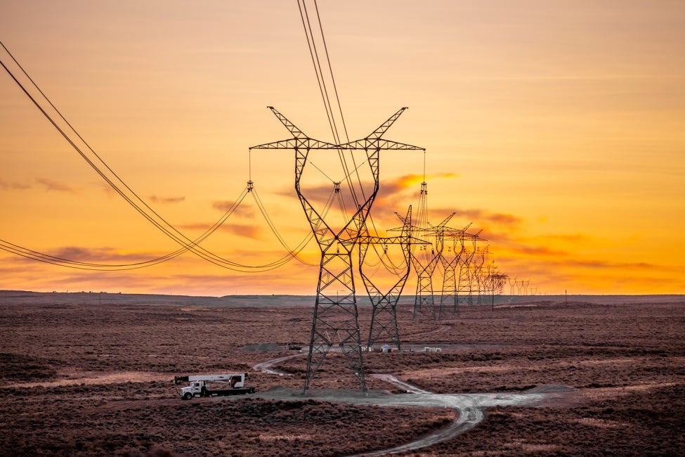 gateway west transmission lines with yellow-orange sky