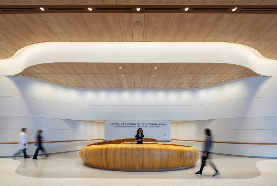 Front Lobby of the Pavilion with Wood Spiral Desk and Soft Lighting