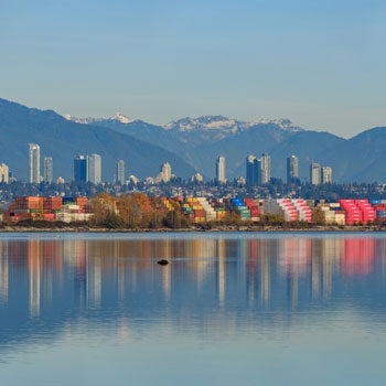 Richmond, BC city skyline with mountains in the background