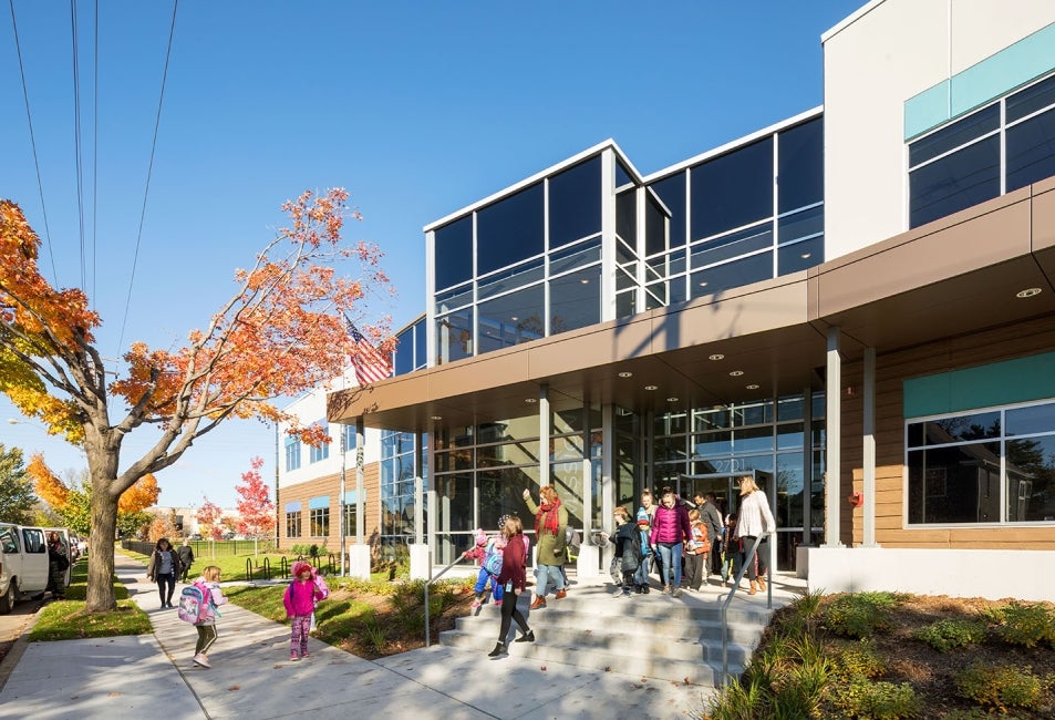 Spero Academy entrance with people