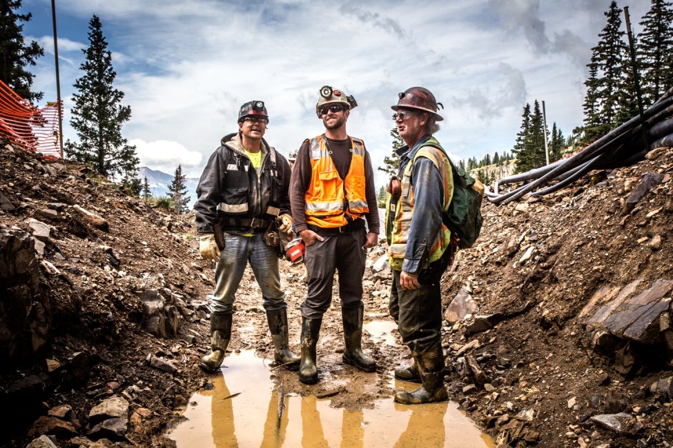 team members standing on site