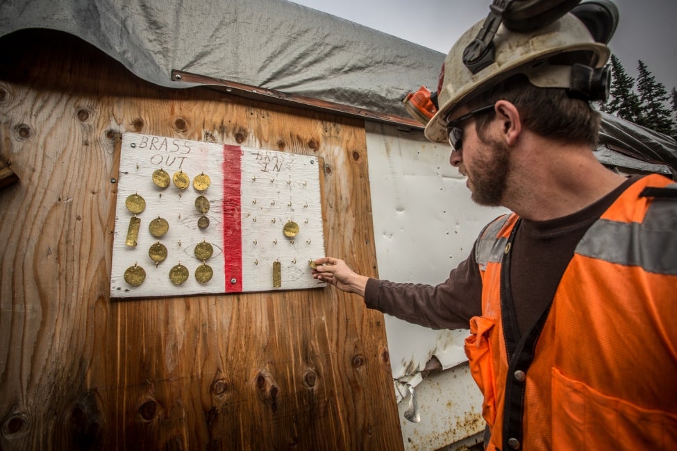 team member checks board