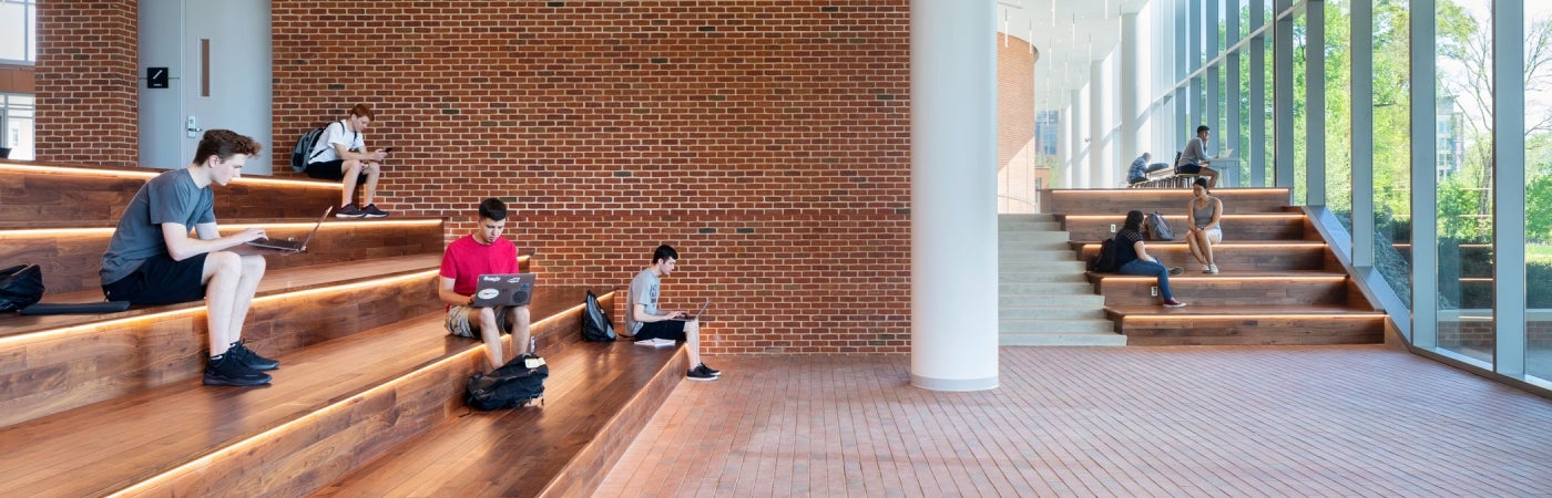 Students studying on active stair within the University of Maryland Brendan Iribe Center for Computer Science and Engineering