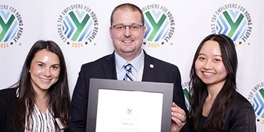 Canada staff receiving award