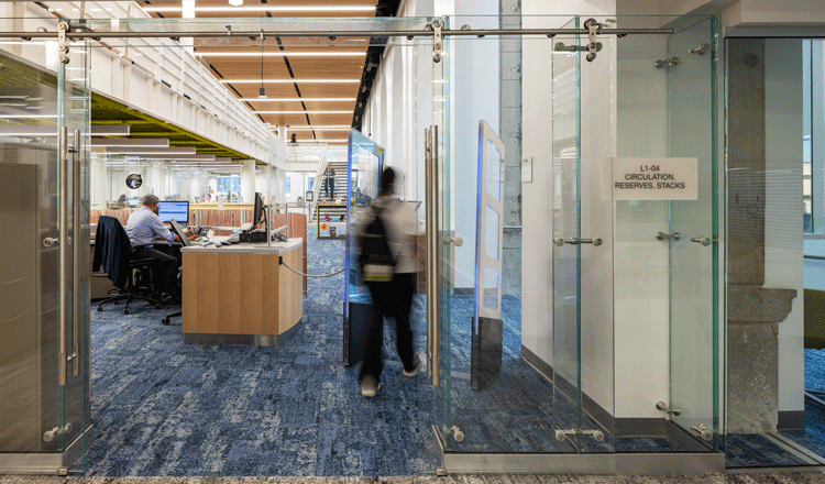 glass enclosed entry to library stacks at the community college of Philadelphia's library and learning commons