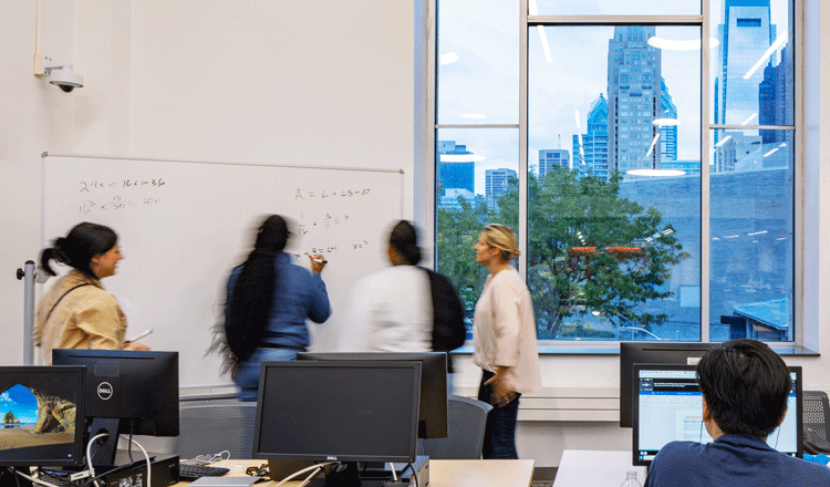 students using white board at the community college of Philadelphia library and learning commons