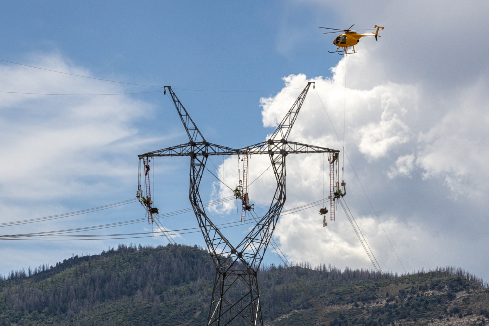 Helicopters working on transmission line