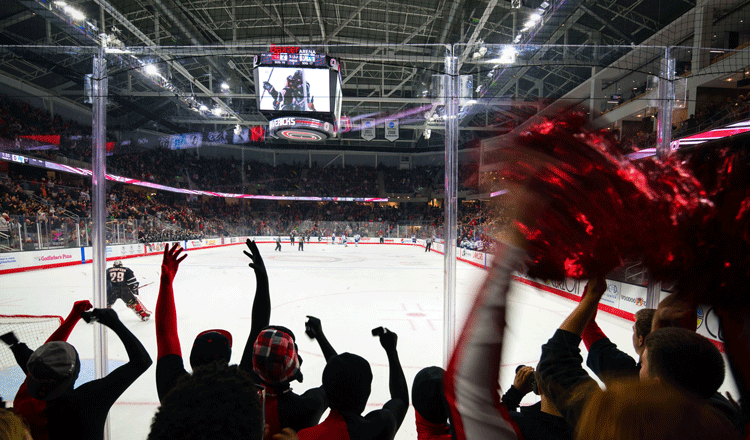 Image of people cheering at the University of Nebraska Baxter Arena