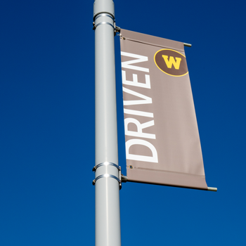 The word "Driven" on a Western Michigan University flag