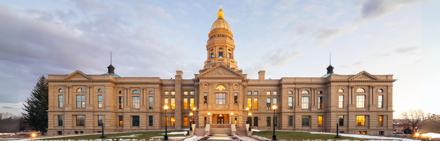 exterior view of wyoming state capitol building at dusk